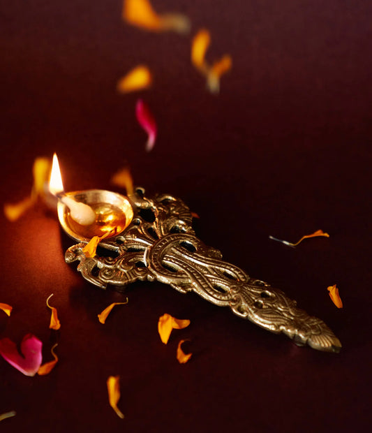 Handcrafted brass aarti diya with intricate detailing, ideal for traditional rituals and home decor