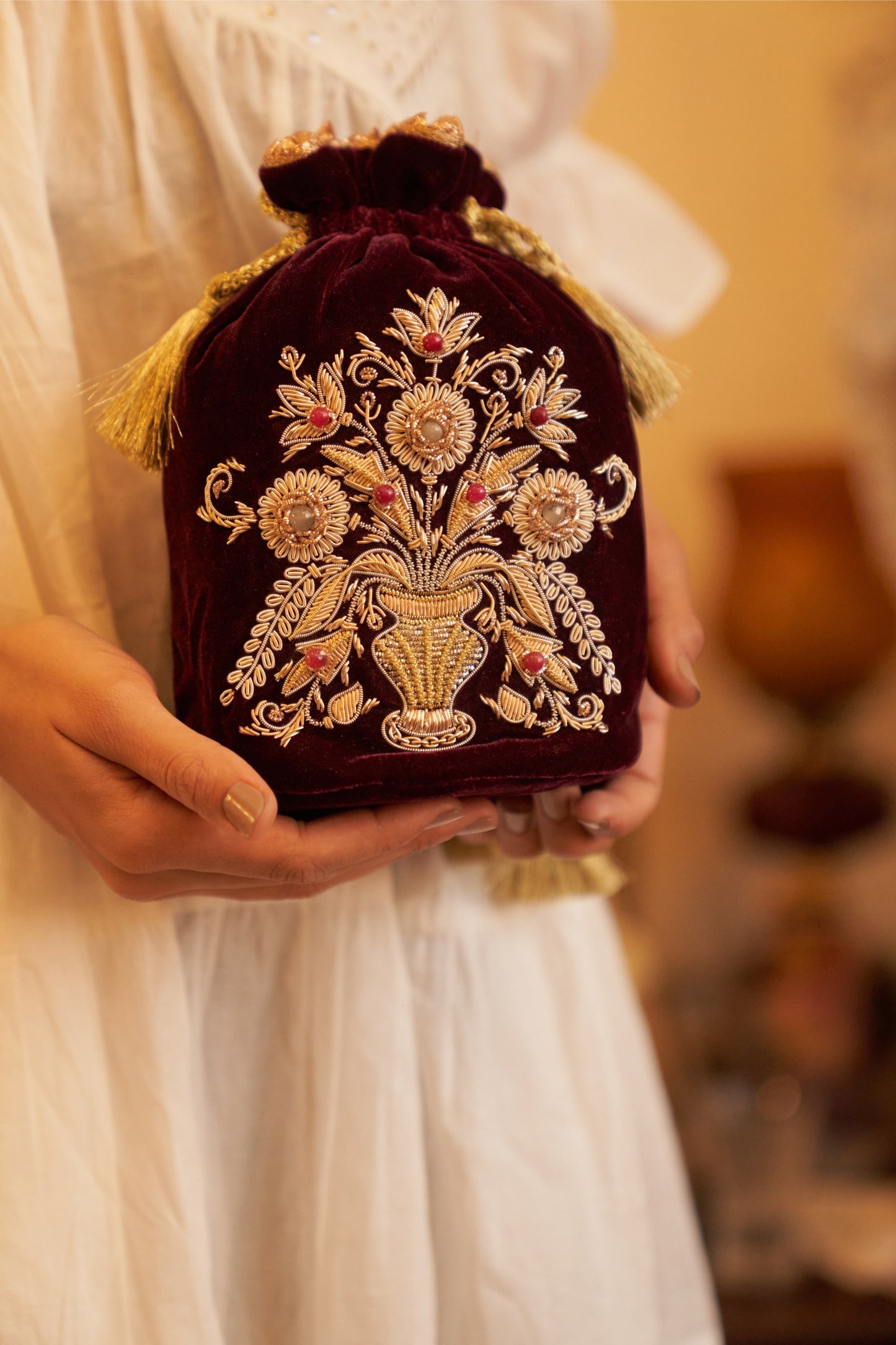 Guldasta medium Zardozi potli bag, featuring intricate gold embroidery with handcrafted floral and bead accents, perfect for elegant occasions