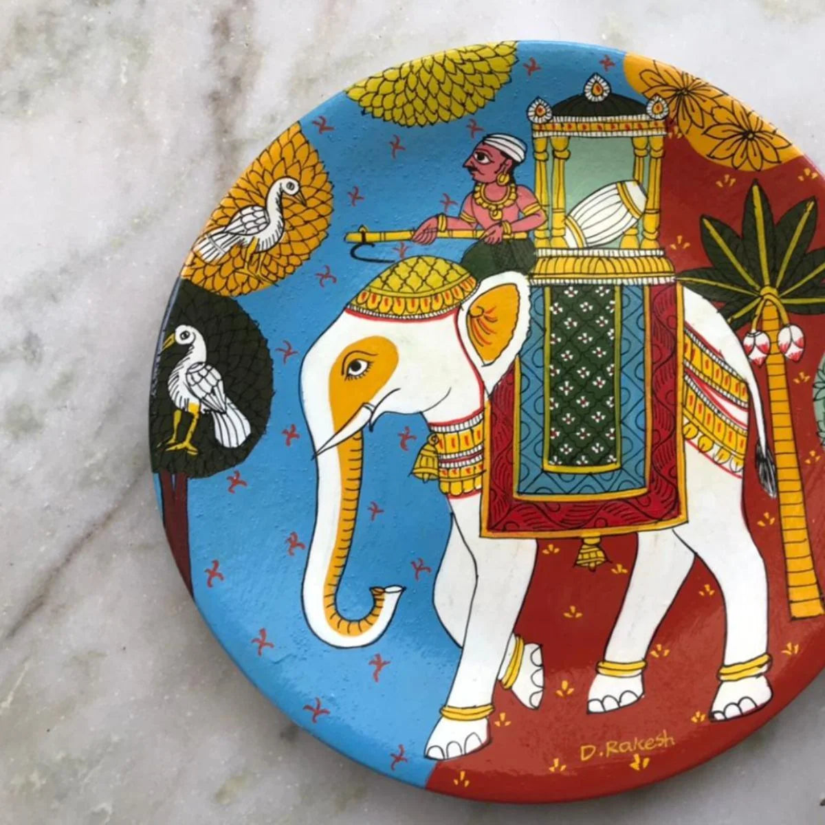 Dol Cheriyal hand-painted plate with intricate traditional patterns, a unique piece of decorative art