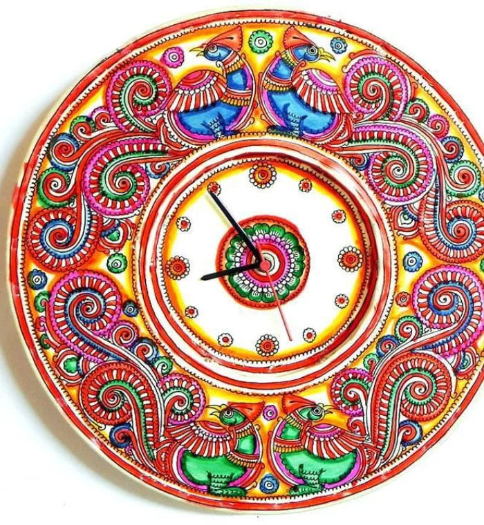 Mor hand-painted Tholu wall clock showcasing a vibrant peacock design, a perfect centerpiece for artisan decor