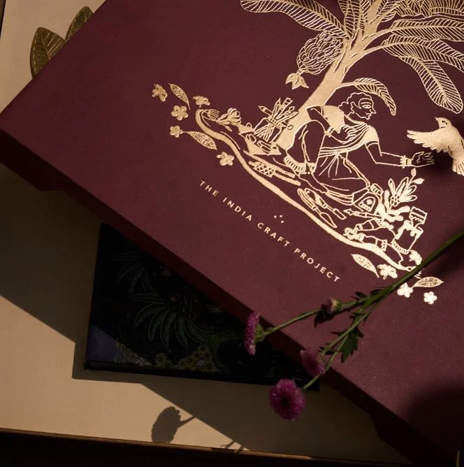 Ramya gift box featuring Chidiya brass tealight holders and TICP playing cards, a unique handcrafted gift set