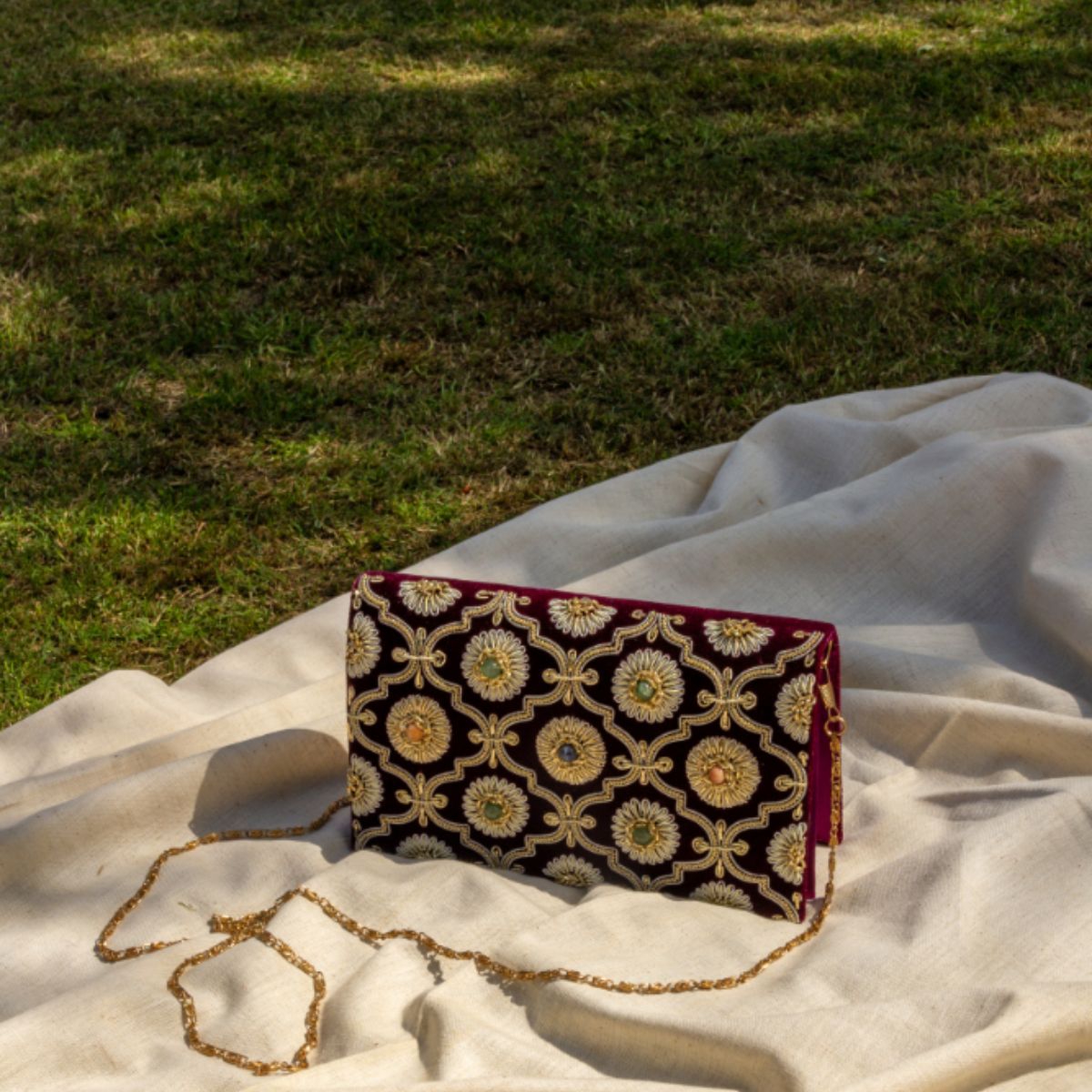 Kat Jaal Zardozi sling purse with detailed gold embroidery, offering a handcrafted and stylish touch