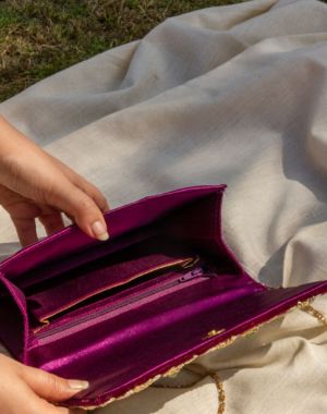 Kat Jaal Zardozi sling purse with detailed gold embroidery, offering a handcrafted and stylish touch