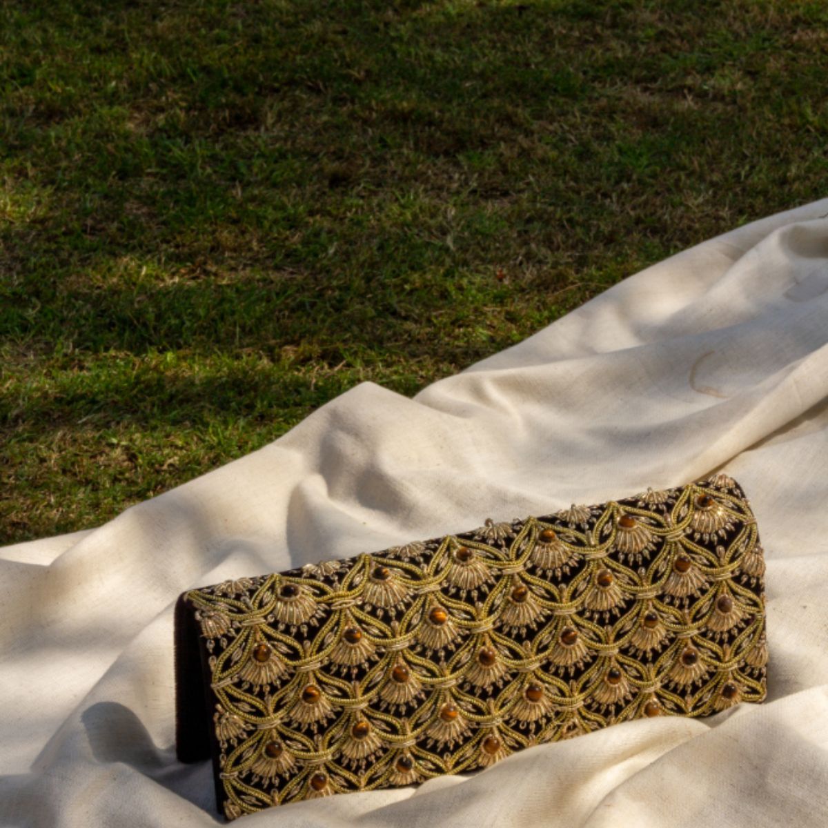 Jhoomar Zardozi clutch purse with intricate gold embroidery and handcrafted details, perfect as an elegant evening bag