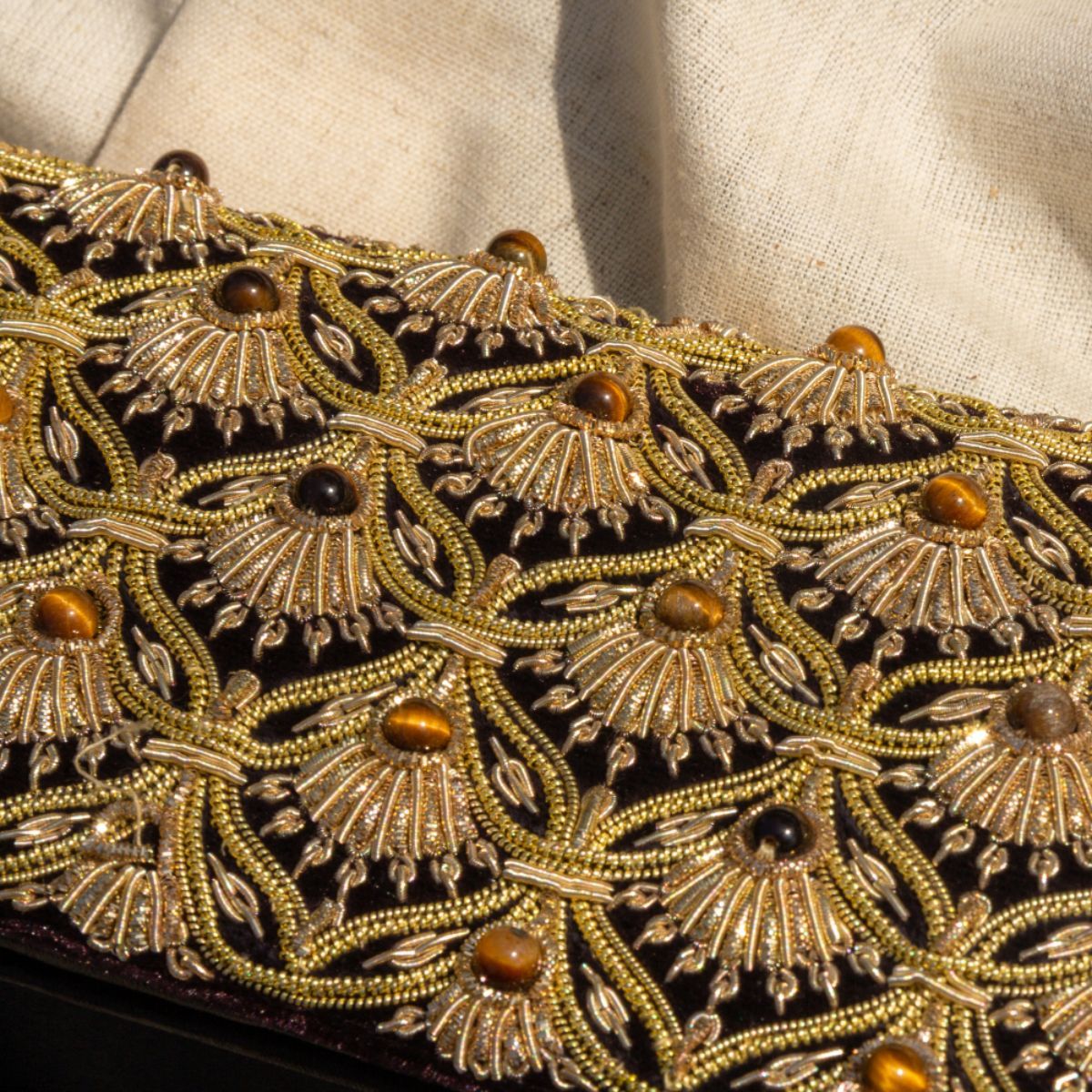 Jhoomar Zardozi clutch purse with intricate gold embroidery and handcrafted details, perfect as an elegant evening bag