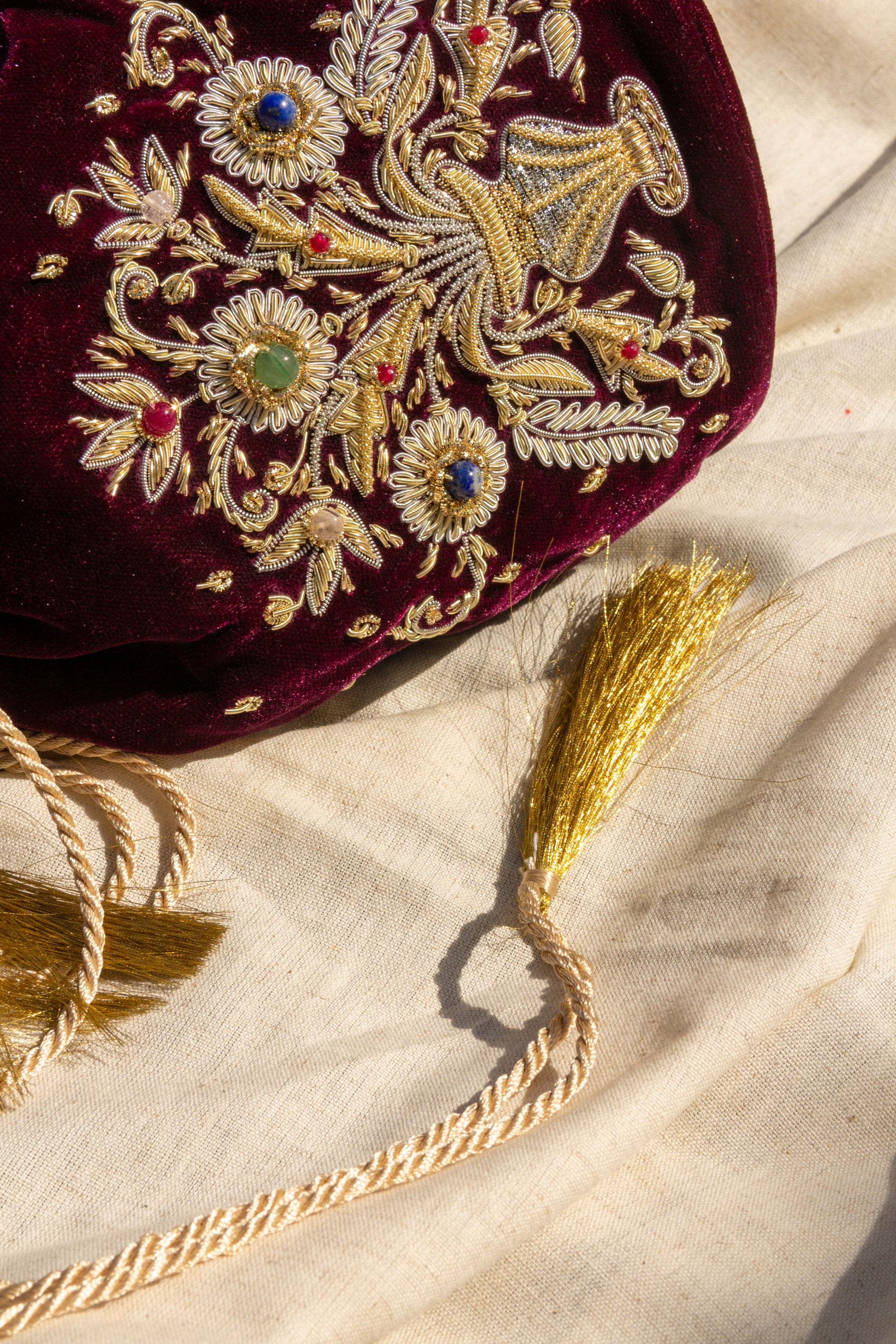 Guldasta medium Zardozi potli bag, featuring intricate gold embroidery with handcrafted floral and bead accents, perfect for elegant occasions