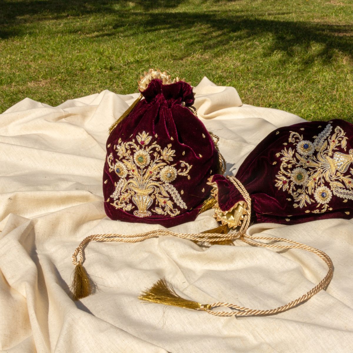 Guldasta medium Zardozi potli bag, featuring intricate gold embroidery with handcrafted floral and bead accents, perfect for elegant occasions