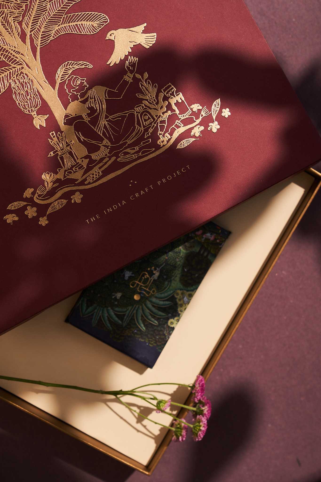 Ramya gift box featuring Chidiya brass tealight holders and TICP playing cards, a unique handcrafted gift set