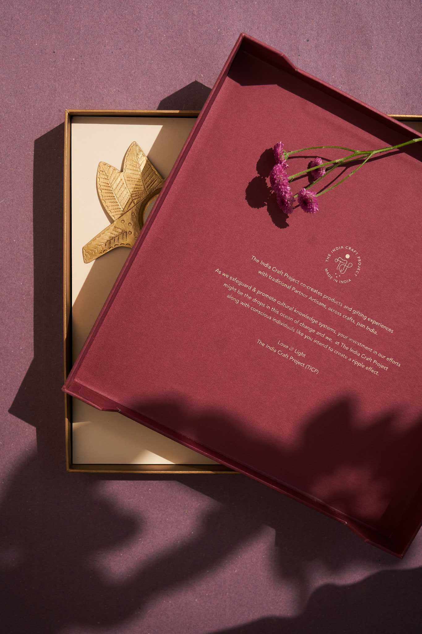 Phool Aarna gift box featuring handcrafted Zardozi and brass tea light holders, a perfect festive decor set