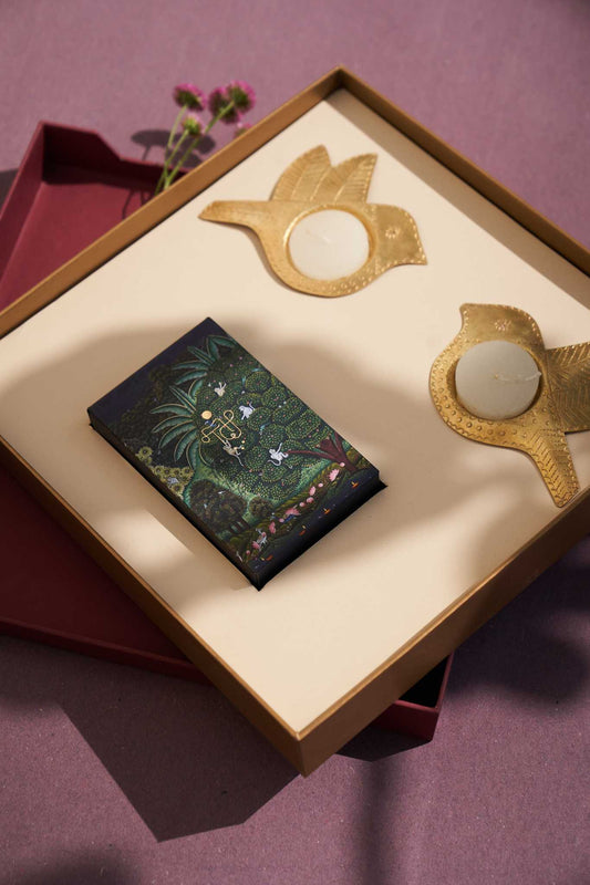 Ramya gift box featuring Chidiya brass tealight holders and TICP playing cards, a unique handcrafted gift set