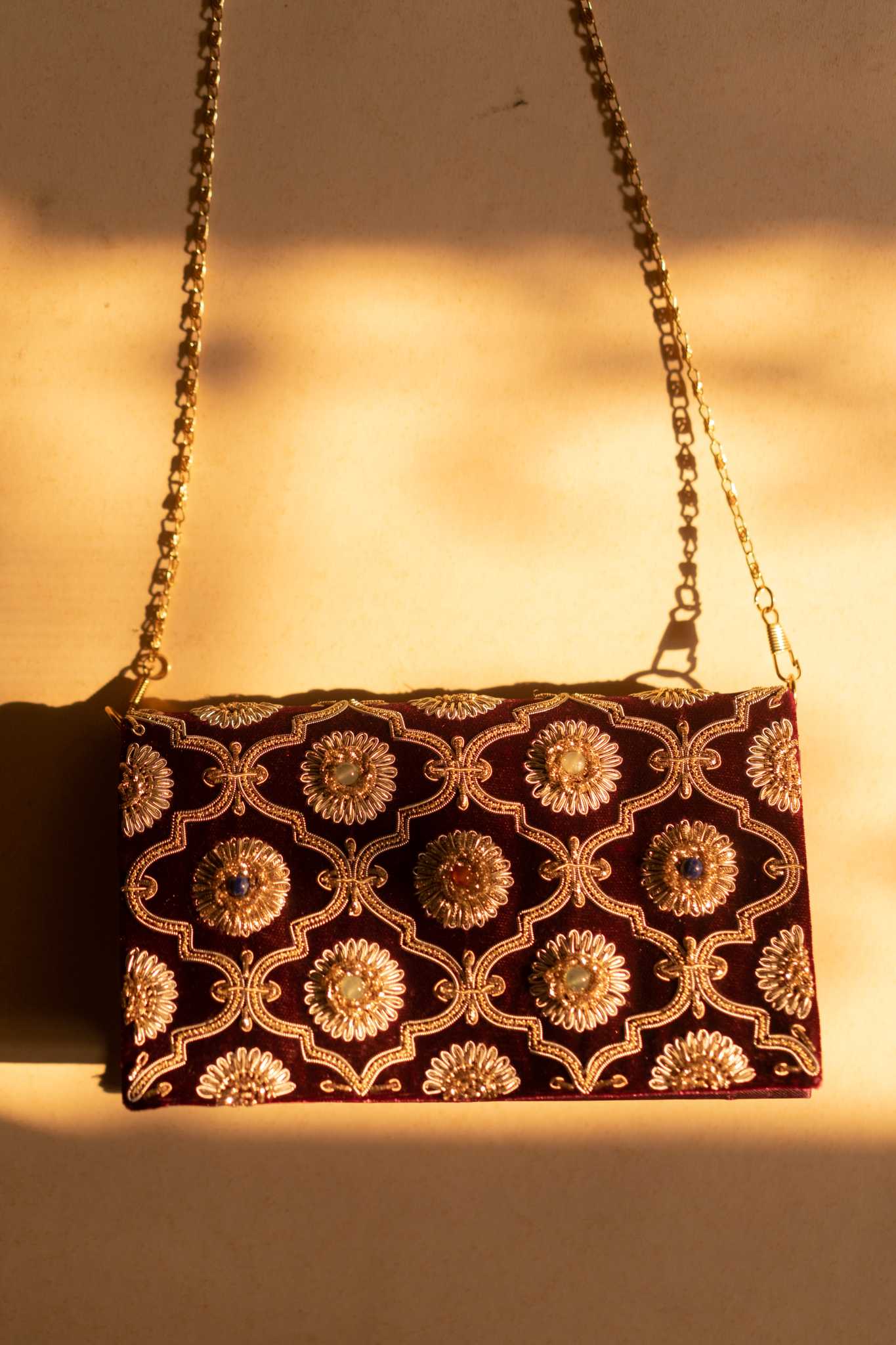Kat Jaal Zardozi sling purse with detailed gold embroidery, offering a handcrafted and stylish touch