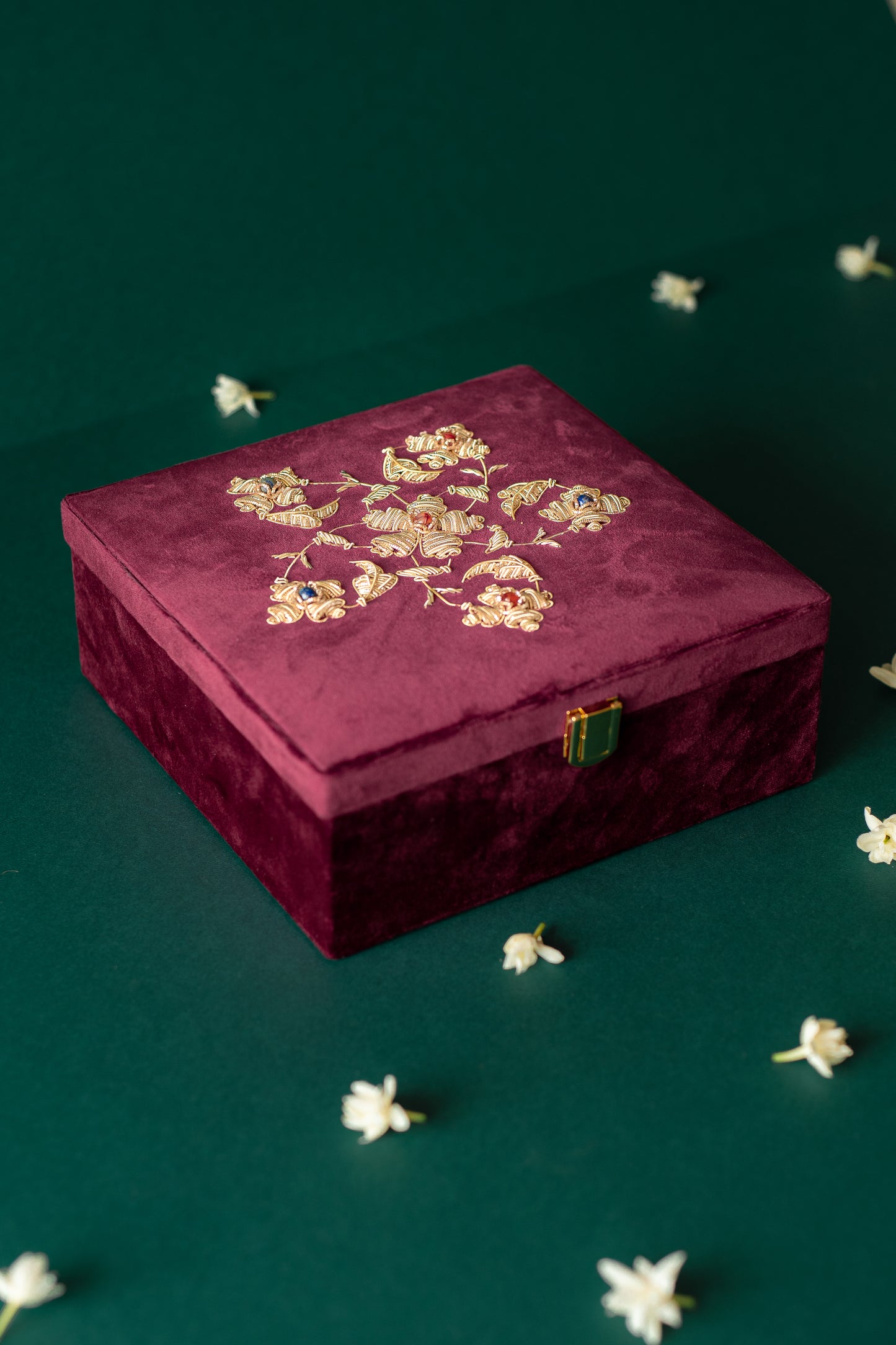 Guldasta Zardozi box with curved plates, showcasing intricate gold embroidery and handcrafted detailing, ideal as an elegant gift set