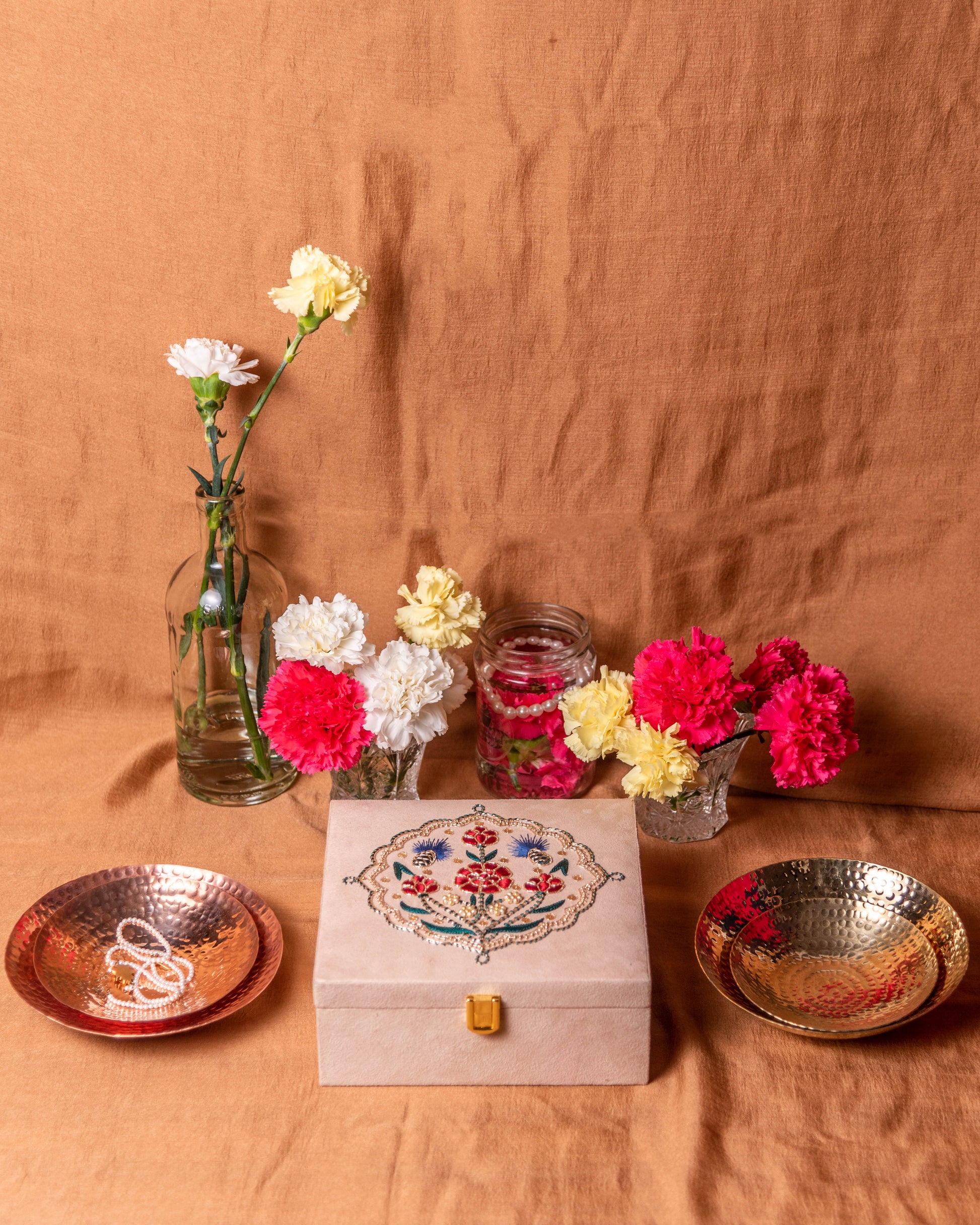 Guldasta Zardozi box with curved plates, showcasing intricate gold embroidery and handcrafted detailing, ideal as an elegant gift set