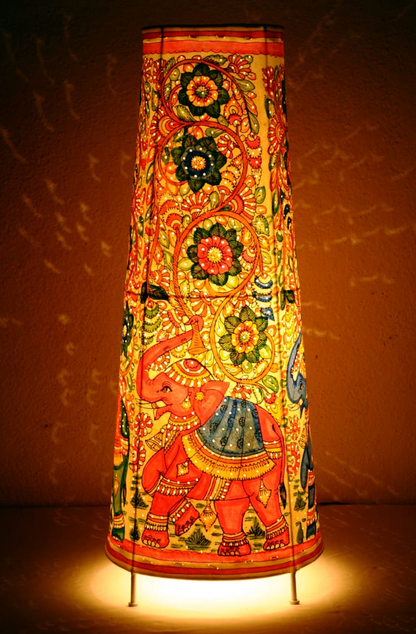 Gajraaj hand-painted Tholu tall corner lamp with intricate elephant designs, a striking artisan piece for ambient lighting