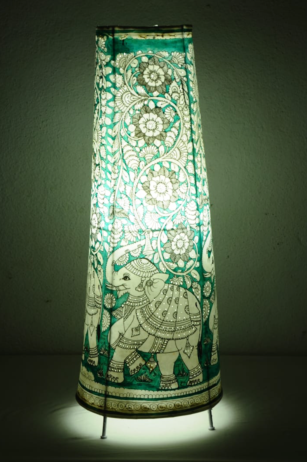 Gajraaj hand-painted Tholu tall corner lamp with intricate elephant designs, a striking artisan piece for ambient lighting