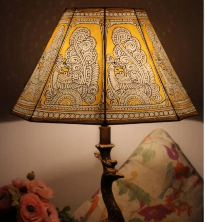 Sunehra hand-painted Tholu lampshade with golden floral accents, adding a luxurious and warm glow to any space