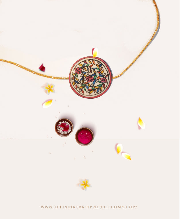 Tholu Bommalata rakhis handcrafted with traditional Tholu art, featuring intricate detailing for festive celebrations
