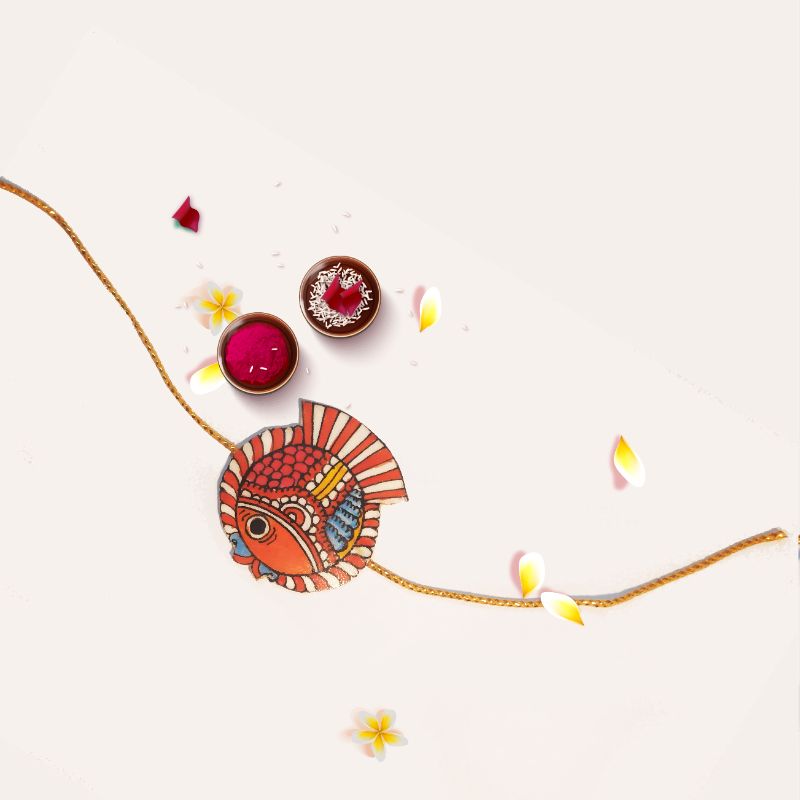 Tholu Bommalata rakhis handcrafted with traditional Tholu art, featuring intricate detailing for festive celebrations
