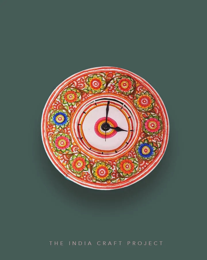 Do Neel hand-painted Tholu wall clock showcasing vibrant blue hues and artistic detailing, ideal for colorful interiors